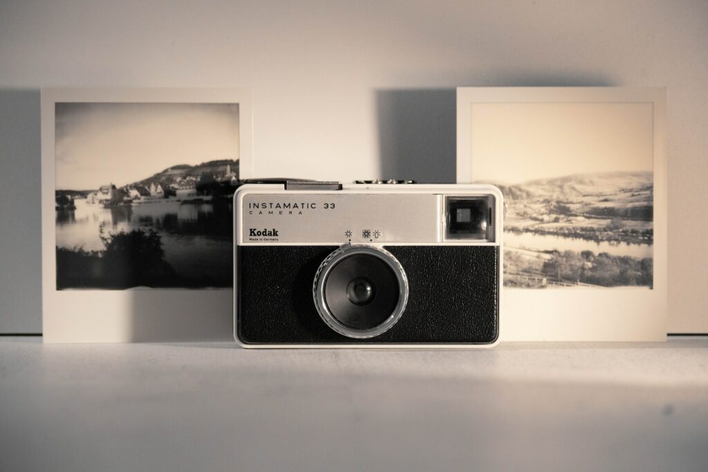 A Kodak camera between old photos